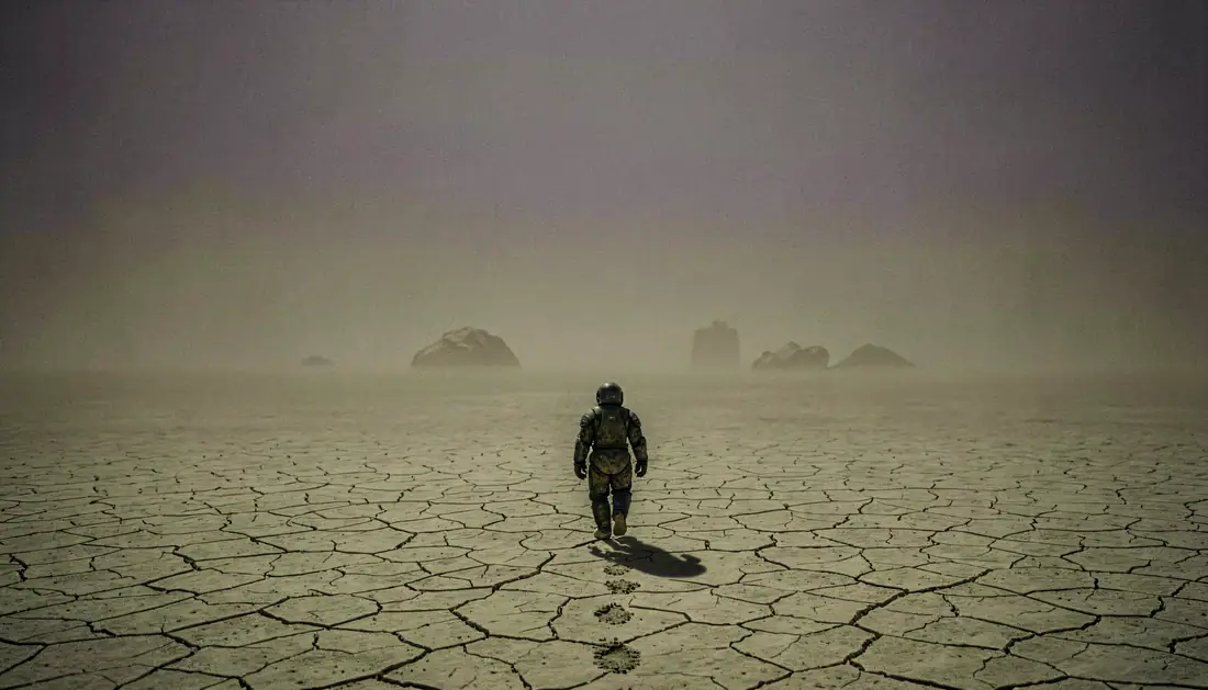 A single figure on a dead world